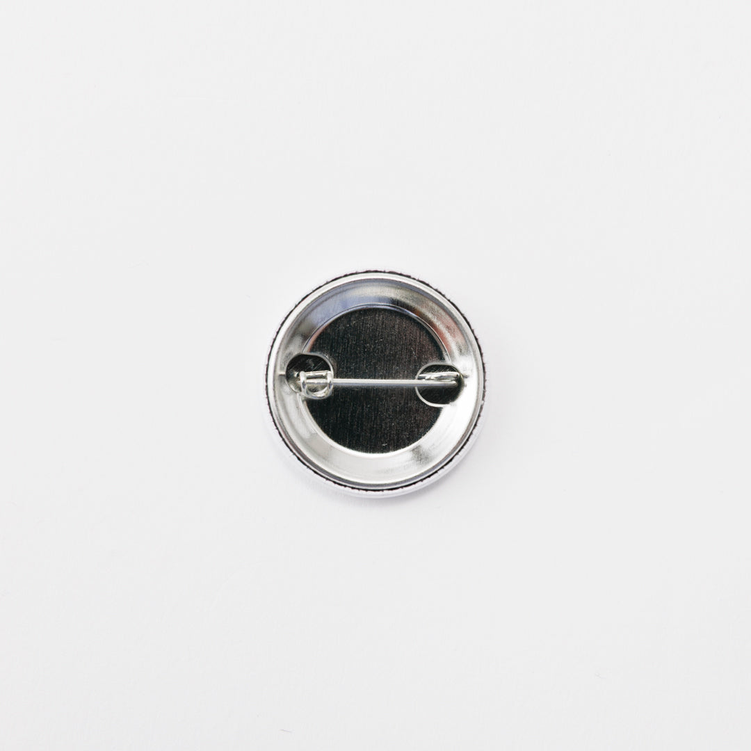Tin badge small (Bird with fish in mouth)