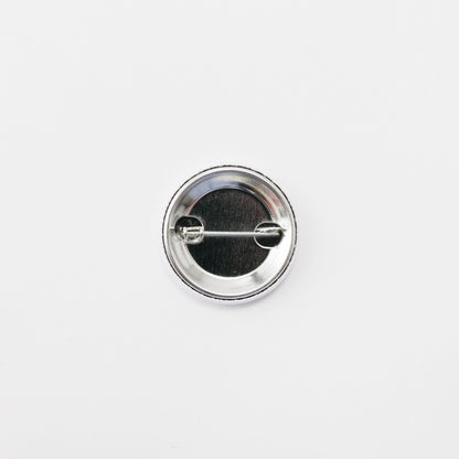 Tin badge small (Bird with fish in mouth)